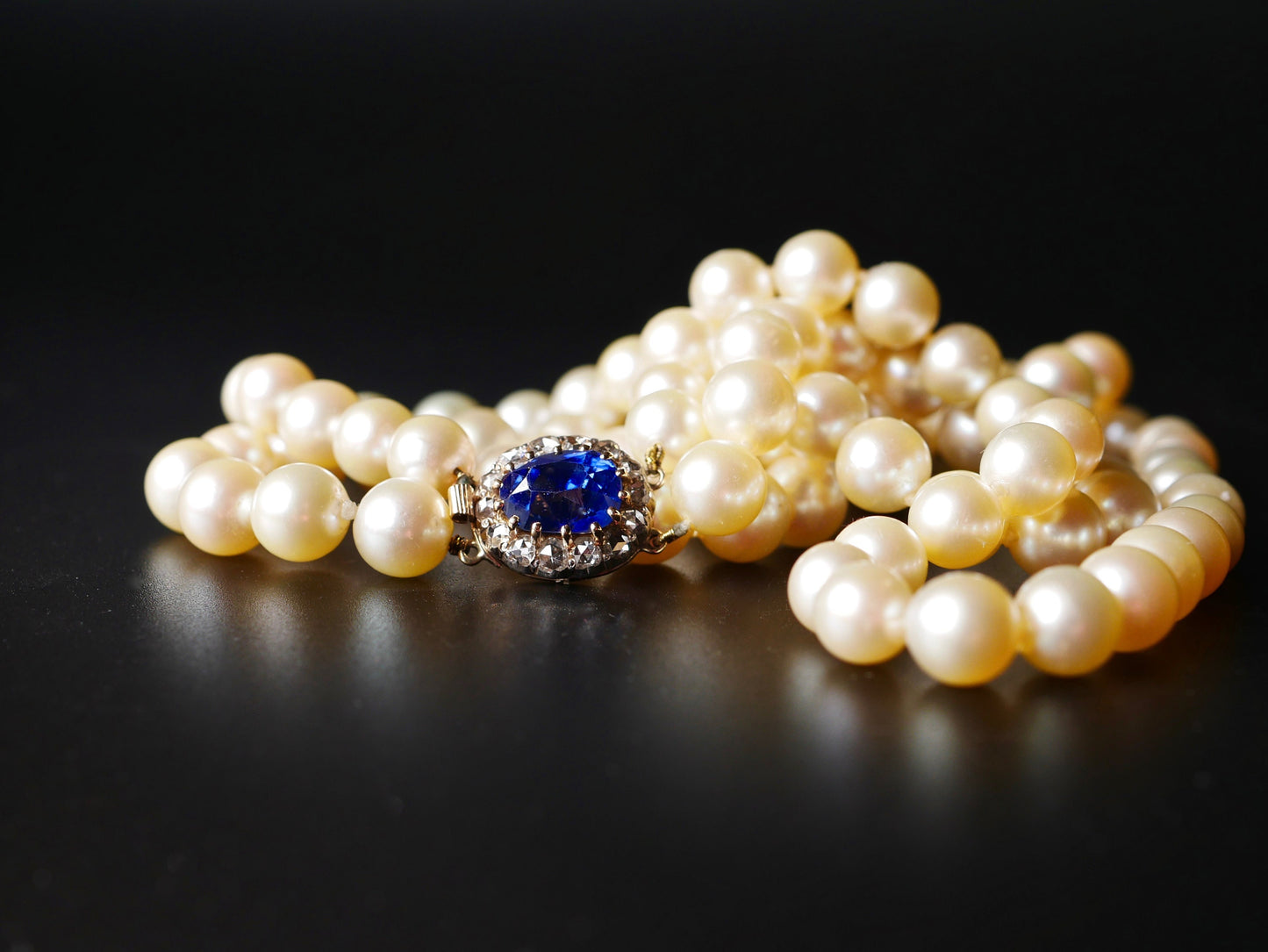 A Graduated Cultured Pearl Double String Necklace With Rose White Diamond & Ceylon Unheated Sapphire Clasp