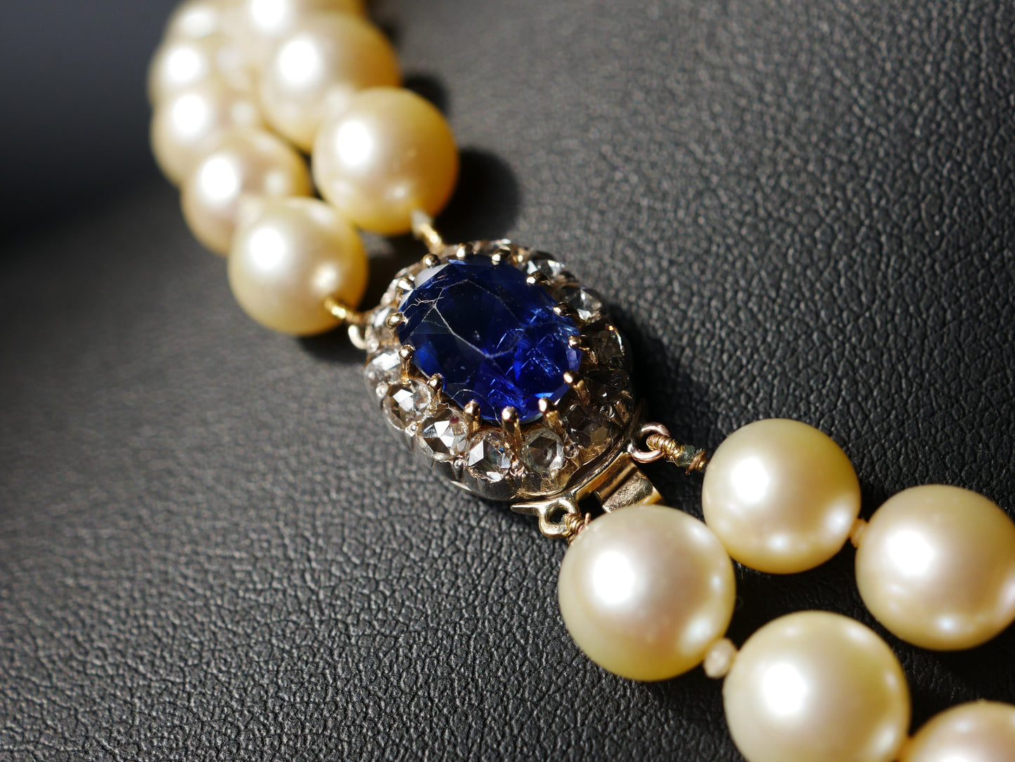 A Graduated Cultured Pearl Double String Necklace With Rose White Diamond & Ceylon Unheated Sapphire Clasp