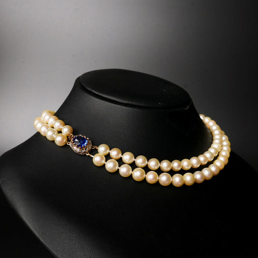 A Graduated Cultured Pearl Double String Necklace With Rose White Diamond & Ceylon Unheated Sapphire Clasp